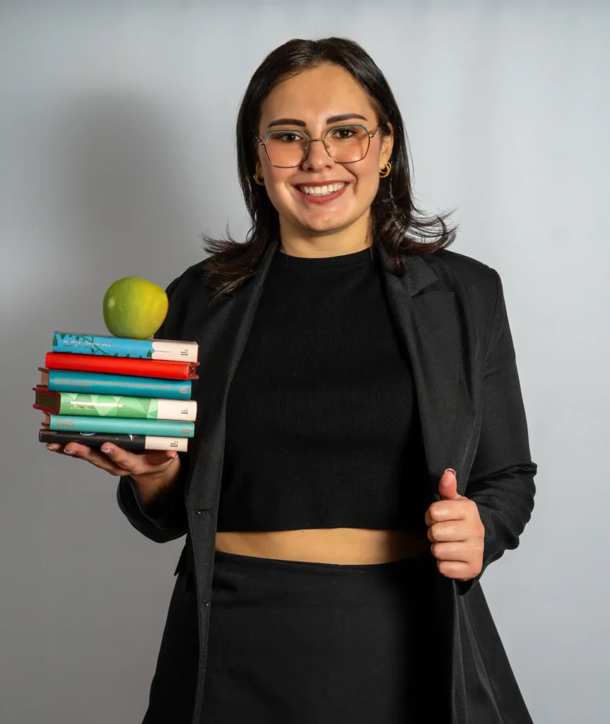 Innerbloom Founder holding books and an apple, providing Grade 0-12 personal tutoring from in bedfordview, linksfield and Pretoria.